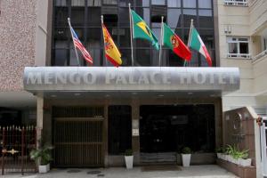 a facade of a mexico palace hotel with flags at Mengo Palace Hotel in Rio de Janeiro