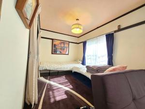 Postel nebo postele na pokoji v ubytování Hayakawa mansion