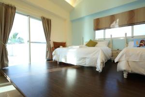 Postel nebo postele na pokoji v ubytování Taroko Bay B&B + 29 fotografií