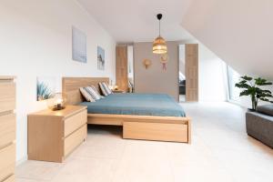 Postel nebo postele na pokoji v ubytování Baltique Apartment - Silamar Zaciszna