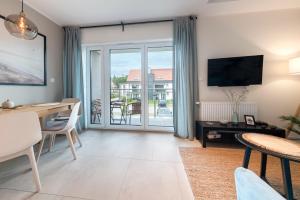 TV a/nebo společenská místnost v ubytování Baltique Apartment - Silamar Zaciszna