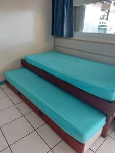 Postel nebo postele na pokoji v ubytování Marina-Carayou 1