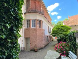 an old brick building with a window and a brick at Apt5 - Ferienwohnung Brötzingen im 4 OG in Pforzheim
