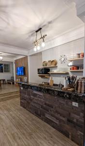 a large kitchen with a counter top in a room at Champollion Hostel in Cairo