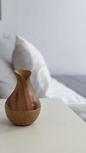 a wooden vase sitting on top of a table at Champollion Hostel in Cairo +50 photos