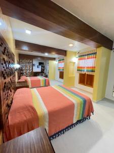 Ένα ή περισσότερα κρεβάτια σε δωμάτιο στο Suites Cárdon