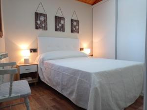 A bed or beds in a room at Magia en el Arco