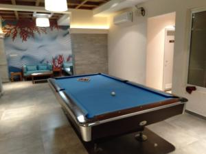 a billiard room with a pool table in it at Nirvana Paraiso in Marmagao