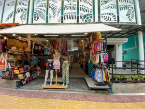 a store with a lot of clothes and other merchandise at Blue Flow Hostel in Phi Phi Islands