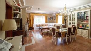 a living room with a table and a couch at Finca Real de Niebla by Ruralidays in Huelva