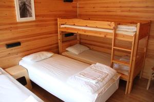 a room with two bunk beds in a cabin at Rastila Camping Helsinki in Helsinki