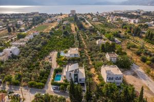 an aerial view of a city with houses and trees at Luxury Villa Loutraki with private heated pool in Loutraki