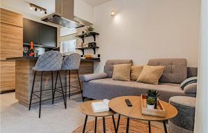 a living room with a couch and two tables at 2 Bedroom Lovely Apartment In Blato in Blato