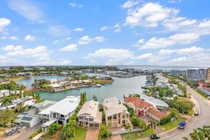 an aerial view of a harbor with houses and boats at Cullen Bay Penthouse with Pool, Decks and Marina Views in Larrakeyah