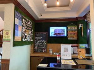 a restaurant with a counter with a chalkboard on the wall at MC Mountain Home in Tagaytay
