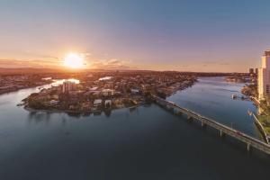 an aerial view of a city at sunset at Vibe Hotel Gold Coast in Gold Coast