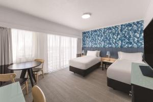 Postel nebo postele na pokoji v ubytování Vibe Hotel Gold Coast