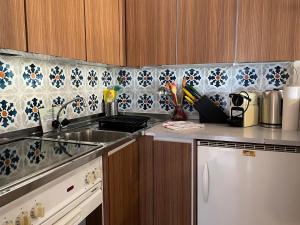 a kitchen with a sink and a counter top at Locarno: Casa Lido in Locarno