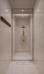 a walk in shower in a white tiled room at Hangzhou Lighting Lanshan Youth Hostel in Hangzhou