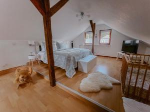 a bedroom with a bed and a dog in it at Ferienhaus Costa Kiesa in Schwarmstedt