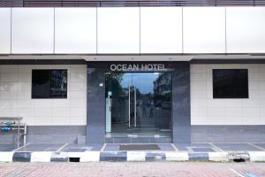 a building with the entrance to an ocean hotel at OCEAN HOTEL in Labuan