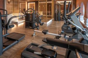 a gym with cardio machines and treadmills at Hotel Alhambra in Santa Susanna