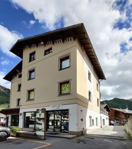 a building with a store on the side of it at Appartamenti Mottini Plaza in Livigno