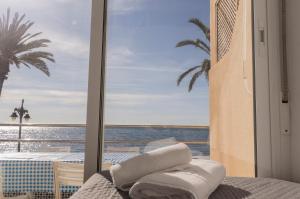 Posteľ alebo postele v izbe v ubytovaní Orilla beach house