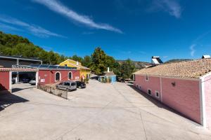 a street in a small town with buildings at Rapia. Casa Azul 6 in Los Granadicos