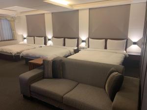 Postel nebo postele na pokoji v ubytování Sun Sweet Hotel