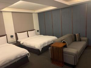 Postel nebo postele na pokoji v ubytování Sun Sweet Hotel