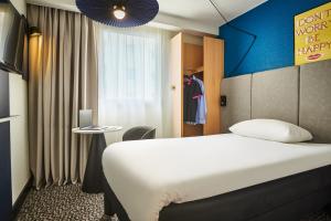 Cama ou camas em um quarto em ibis Paris Avenue d'Italie 13ème