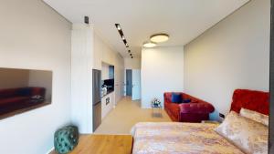 a bedroom with a bed and a living room at Seabreeze, Lighthouse, Baku, Azerbaijan in Baku