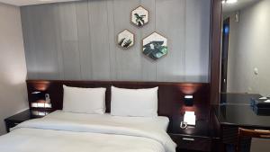 Postel nebo postele na pokoji v ubytování Sun Sweet Hotel