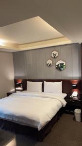 Postel nebo postele na pokoji v ubytování Sun Sweet Hotel