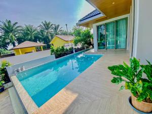 a swimming pool in the backyard of a house at In Town Pool Villa Krabi in Ban Khlong Chi Lat