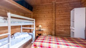 Łóżko lub łóżka w pokoju w obiekcie Bois de Champelle- 94 Magnifique Chalet-10 pers