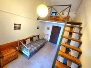 a living room with a couch and a bunk bed at House & Yard Sesil XL 90m to beach in Ureki