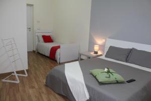 Posteľ alebo postele v izbe v ubytovaní L'Iris B&B