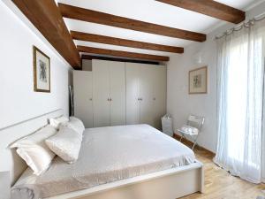 A bed or beds in a room at UR NEST Santo Stefano