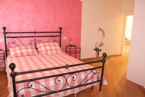 Posteľ alebo postele v izbe v ubytovaní L'Iris B&B
