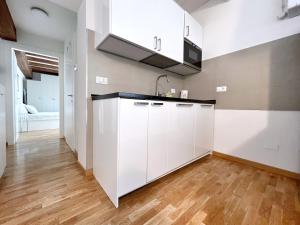 A kitchen or kitchenette at UR NEST Santo Stefano