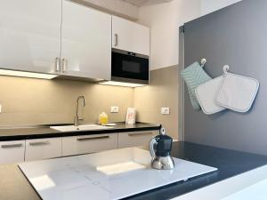 A kitchen or kitchenette at UR NEST Santo Stefano