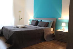 Posteľ alebo postele v izbe v ubytovaní L'Iris B&B