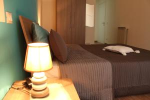 Posteľ alebo postele v izbe v ubytovaní L'Iris B&B