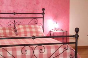 Posteľ alebo postele v izbe v ubytovaní L'Iris B&B