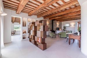 a large living room with a wooden ceiling at Villa Aga - Homelike Villas in Cingoli