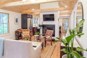 a tiny house with a living room with a fireplace at Lake Winni Cottage in Moultonborough