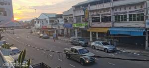 a city street with cars parked on the street at Hideaway ~ Best Memories start here! in Mersing