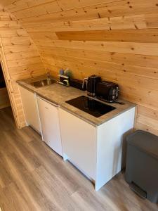 a kitchen with a sink and a counter top at Outdoor Inns - Star at Lidgate in Newmarket